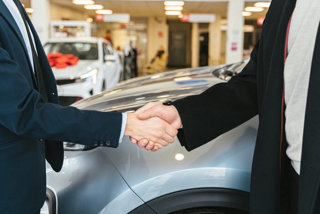 Customer shaking hands after selling their car for cash in Dublin to us. 